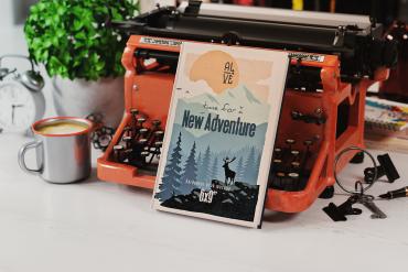 Hardcover Book Near Old Typewriter Mockup