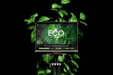 Laptop on Vintage Chair with Green Plant Mockup