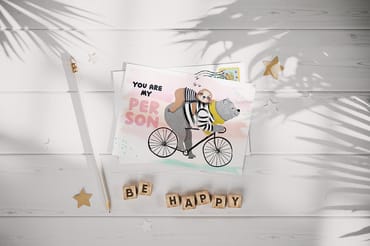 Postcard on the White Wooden Surface Mockup