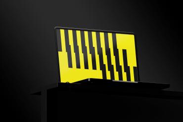 Laptop on Black Table Mockup