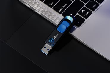 USB Flash Drive Near the Laptop Mockup