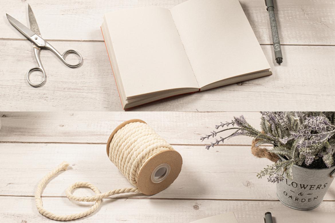 Sketch Notebook Mockup on a White Wood Table with Ornaments