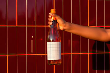 Hand Holding Wine Label Sunset Mockups